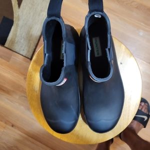 A pair black rubber rain boots
